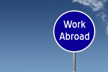 Round highway road sign with text work abroad