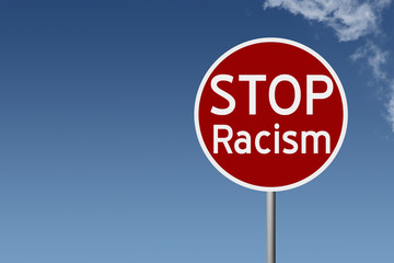 Round highway road sign with text STOP Racism