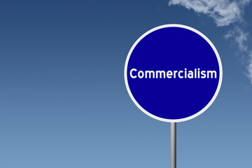 Sign with text Commercialism on sky background