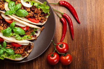 Mexican tacos with minced meat, beans and spices