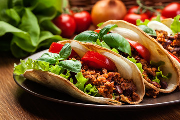 Mexican tacos with minced meat, beans and spices