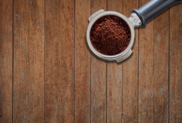 Coffee grind in group on wooden background