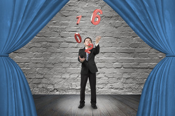 Businessman catching throwing 2016 red words