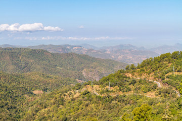 Fototapeta na wymiar Landscape view from mountain top with haze