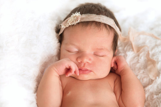 Sleeping newborn baby girl
