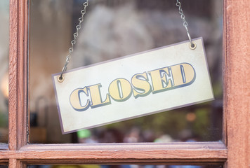 Closed sign board in front of shop
