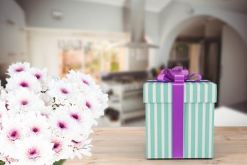 Composite image of blue and silver gift box