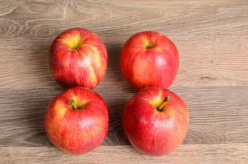 Red apples on wood