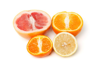 Halfes of grapefruit, orange, lemon and mandarin isolated on white