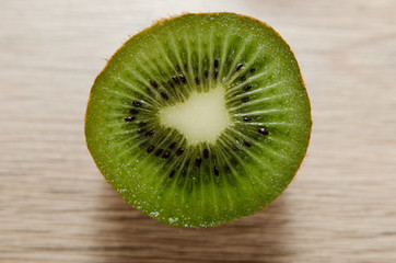 Ripe kiwi on wooden table close-up