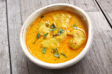 Stewpot of Indian curry and spices.