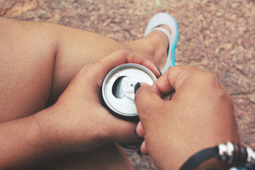 Fototapeta premium Woman drinking cola can