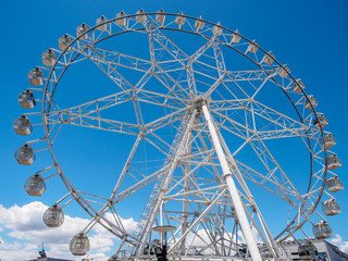 Ferris wheel with blue sky