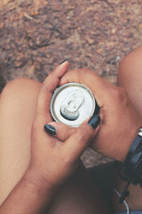 Woman drinking cola can