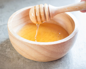 Golden honey cup and dipper