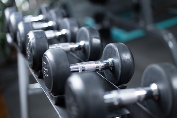 Naklejka premium dumbbells in modern gym