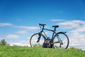 Fototapeta na wymiar Bike in green summer meadow