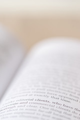 Fototapeta premium Macro shot of open book. Focus on word 