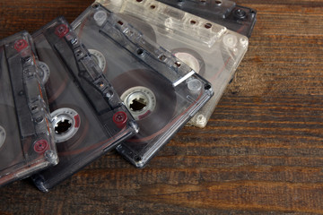 grey audio tapes on brown wooden background