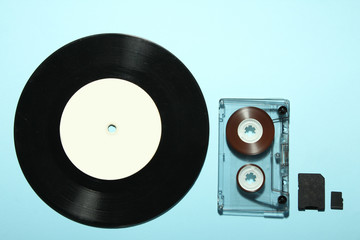 vinyl record and audio cassette from MicroSD on a blue background