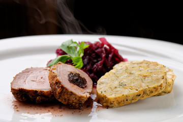 Spit roast with red cabbage and dumplings