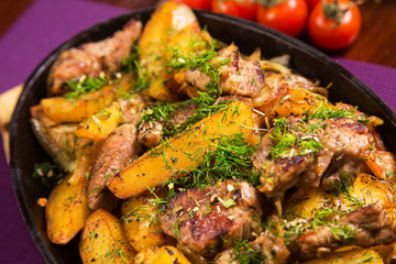 meat with potatoes in pen