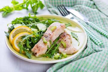 Slice steamed fish with spicy sauce and salad