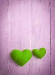 Vintage green heart on pink background