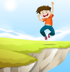 Boy jumping on the cliff
