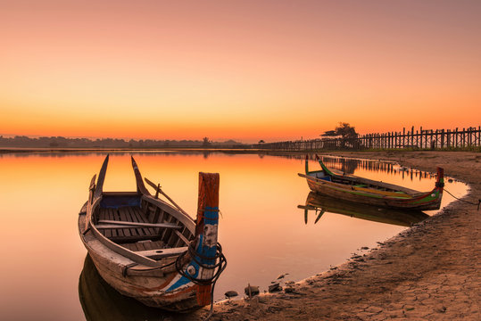 Wooden boat in Ubein Bridge at sunrise, Mandalay, Myanmar (World