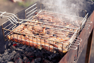 shashlik. preparation of marinated meat over hot coals