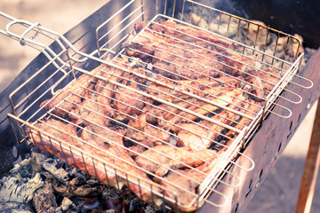 shashlik. preparation of marinated meat over hot coals