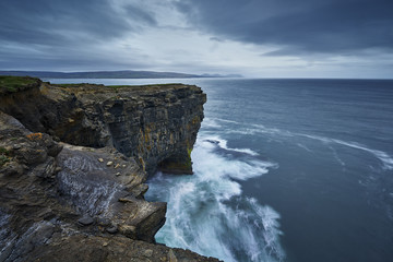 Obraz premium Sitting out in the wild Atlantic Ocean, Downpatrick Head is an area of unrivalled coastal beauty and historical importance, nature