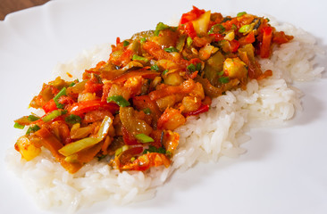 Rice with mixed vegetables on white plate