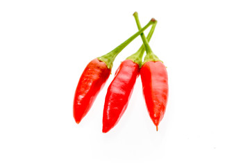 Red hot chili peppers Cayenne, Serrano with green stem.