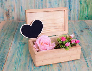 heart shape in box on wooden table