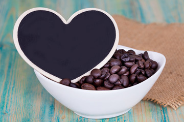 heart shape with coffee bean on wooden