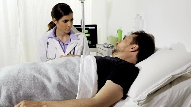 Man lying in bed in hospital scared about bad news from doctor closeup