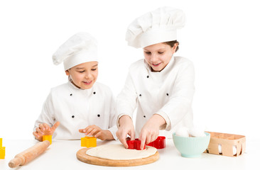 children-cooks playing forms for dought cutting