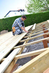 Obraz na płótnie Canvas Carpenter building wooden deck