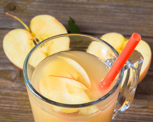 Fresh apple  juice on wooden background