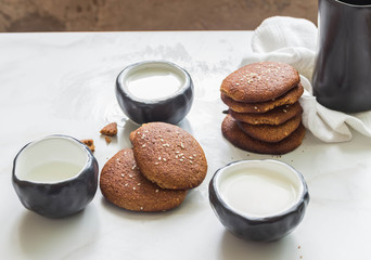 Buckwheat-oatmeal cookies with sesame seeds and milk