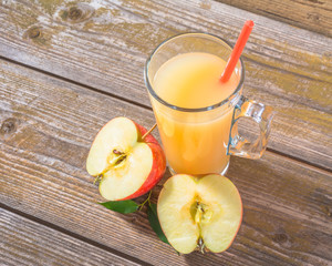Fresh apple  juice on wooden background