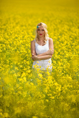 Fototapeta premium hippie girl standing in yellow field