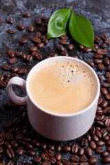cup of fresh americano on coffee beans background