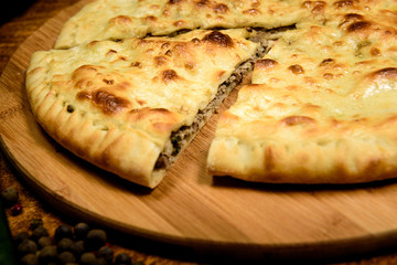 Traditional meat closed pie with spices