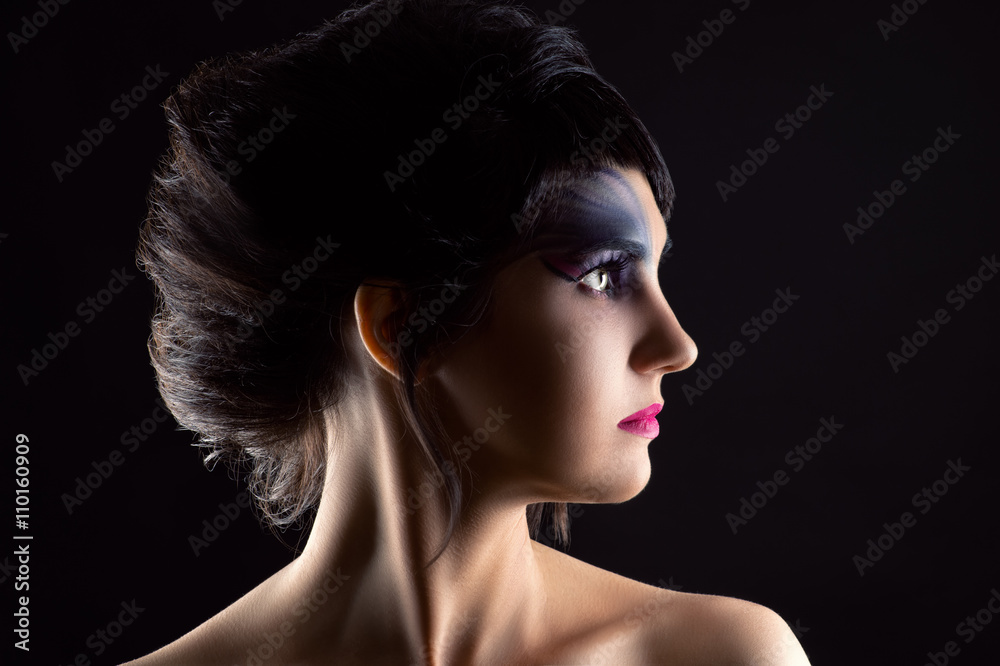 Wall mural beautiful woman with luxurious hair and makeup, portrait in profile face