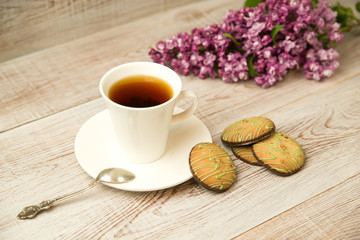 Cup and chocolate chip cookies on the table