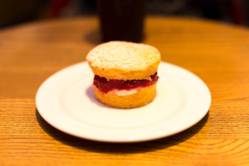 Selected focus on strawberry jam English scone