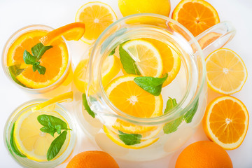 Preparation of the lemon and orange in a jug with mint leaves